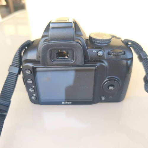 Nikon D3000 camera with AF-S 18-55mm f/3.5-5.6 lens and bag