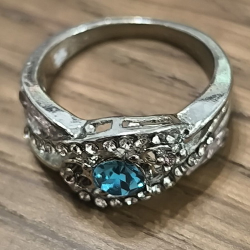 Silver vintage ring with blue zircon and white stones