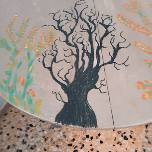 Round table with painted design, chalk paint