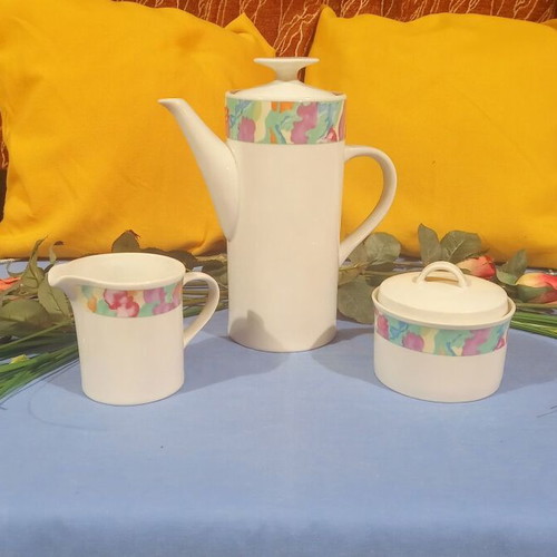 China tea set with 6 cups and saucers, creamer, sugar bowl, and teapot