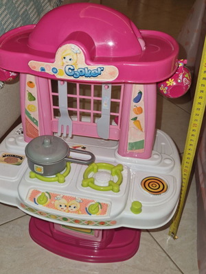 Children's kitchen playset like new with pot, knife, and fork