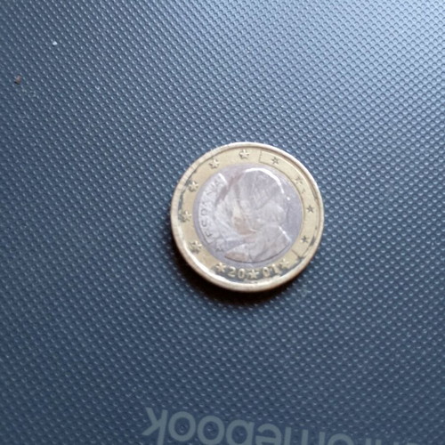 One euro coin used, unrecognizable
