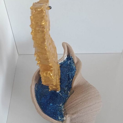 Handmade decorative gold seahorse from clay and resin with brown shell base