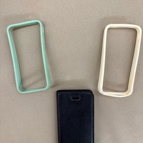 iPhone 4/4s cases set used, 2 silicone bumpers and 1 flip wallet