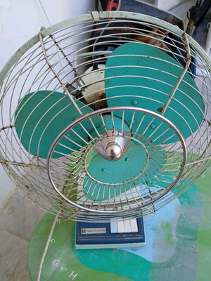 Antique metal fan used in normal working condition