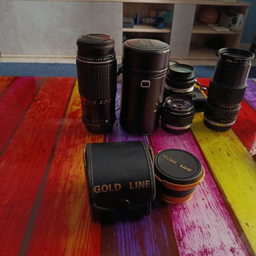 Olympus OM-2S analog camera kit with lenses and Gold Line accessories