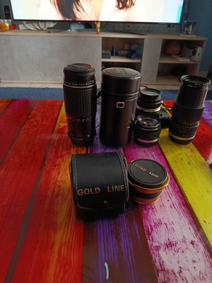 Olympus OM-2S analog camera kit with lenses and Gold Line accessories