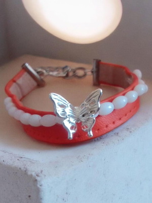 Handmade bracelet with beads on leatherette