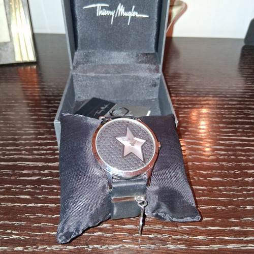 Thierry Mugler wristwatch with leather strap and silver star charm
