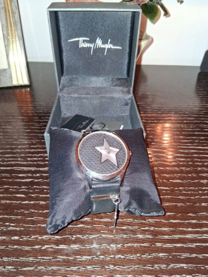 Thierry Mugler wristwatch with leather strap and silver star charm
