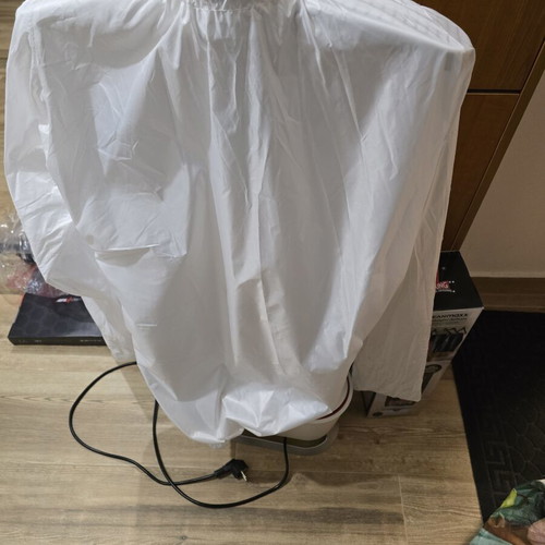Automatic ironing machine for shirts and trousers