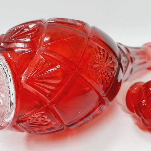 Vintage red glass bottle with decorative stopper, like new