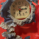 Clock used with dolphins around