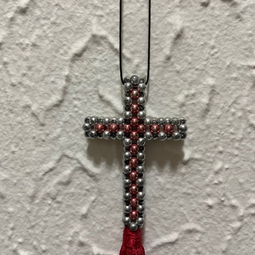 Decorative cross with beads and red tassel like new