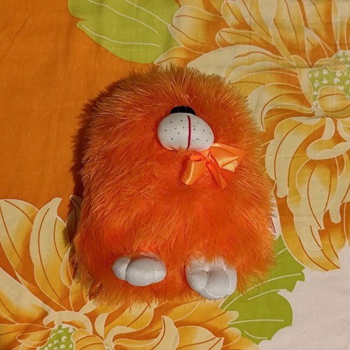 Orange dog plushie like new, very soft