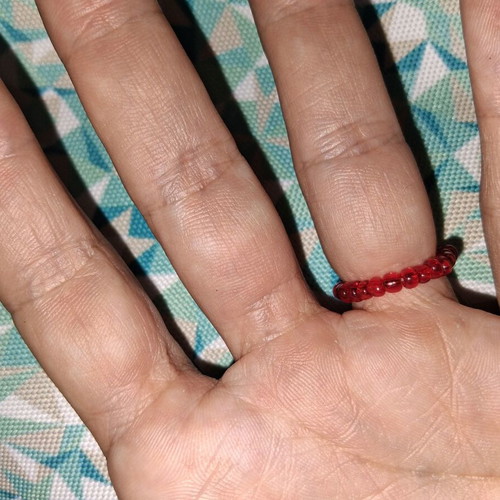 Elastic ring with beads and strawberry center