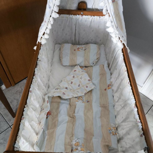 Wooden baby cot like new with wheels and mosquito net