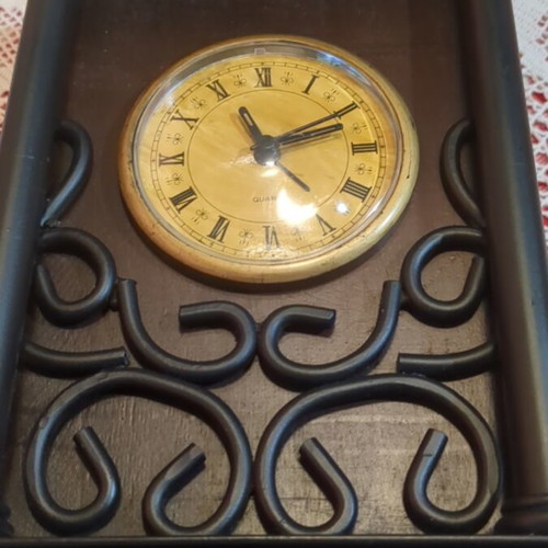 Vintage decorative tabletop clock with wooden and wrought iron details