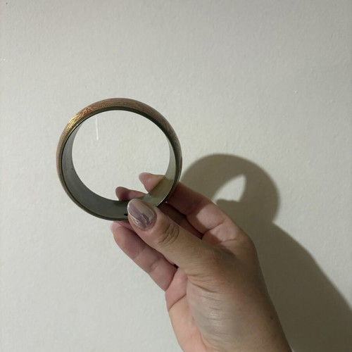 Metal bracelet used, gold color