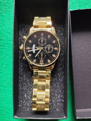 Geneva watch in gold color with black dial like new