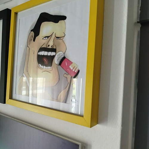 Handmade caricature wall art with signature in glass frame 35x35 cm