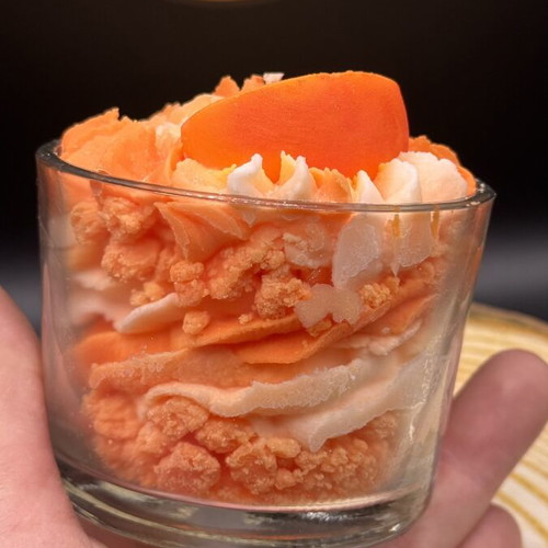 Handmade soy candle in glass container with peach scent
