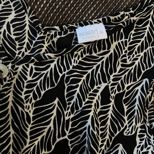 Infinity sleeveless top with black and white leaf pattern, like new
