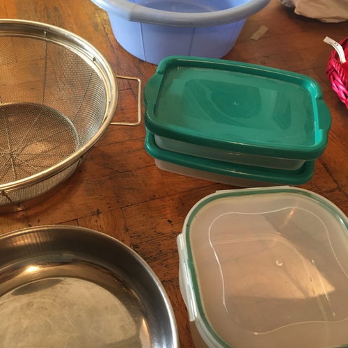 Kitchen items used, tupperware, strainer, basin