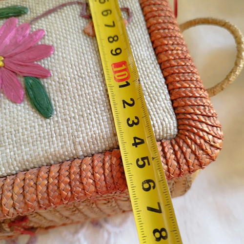 Vintage wicker sewing box with floral decoration used
