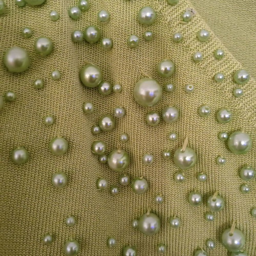 Knitted top used green lime with green pearls, size S