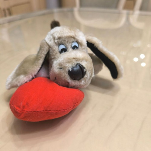 Plush dog with red heart like new