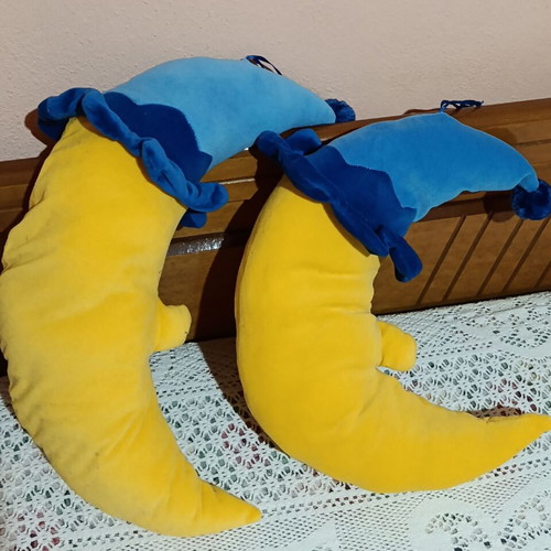 Set of 2 plush moon pillows used for kids' room decor