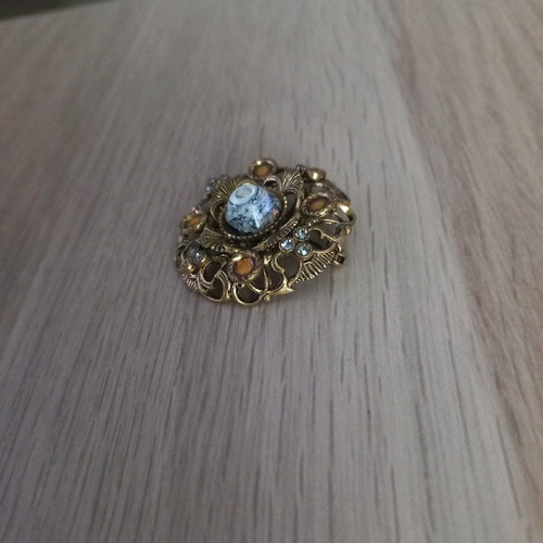Traditional old brooch with stone
