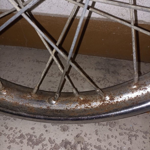 Motorcycle rim used, old with surface rust and missing spoke