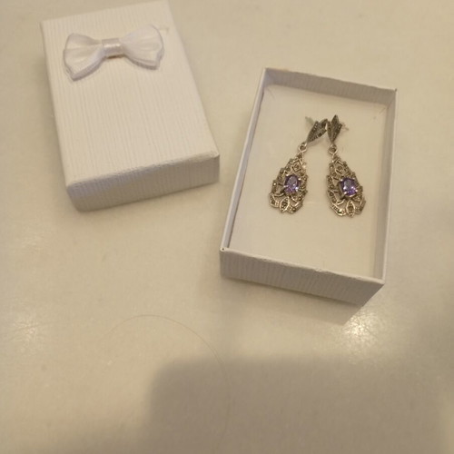 Silver earrings with purple stones