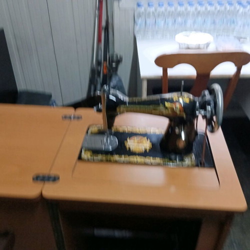 Singer antique sewing machine like new with cabinet