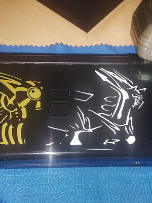 Nintendo DS Lite used with Dialga and Palkia reshell, charger, stylus, and carrying case