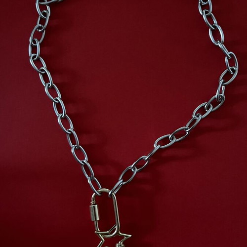Long pendant with silver chain and gold rings, star and diamond-shaped drop