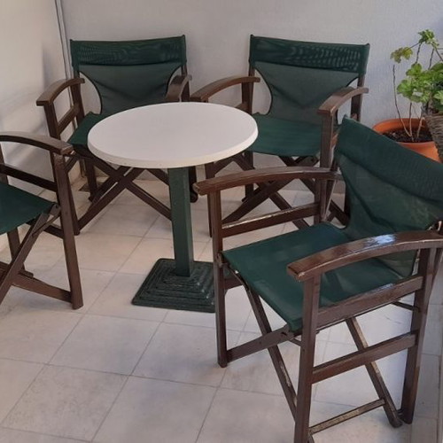 Outdoor lounge furniture used with 4 director chairs and metal table