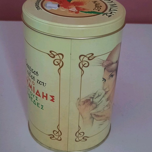 Collectible metal cylindrical Loumidis parrot tin new