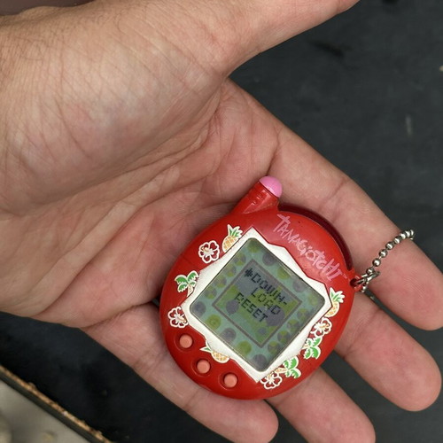 Vintage Tamagotchi Bandai 2004 red tropical design electronic keychain used