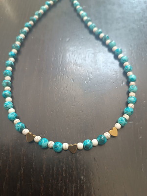 Handmade beaded necklace with gold heart detail