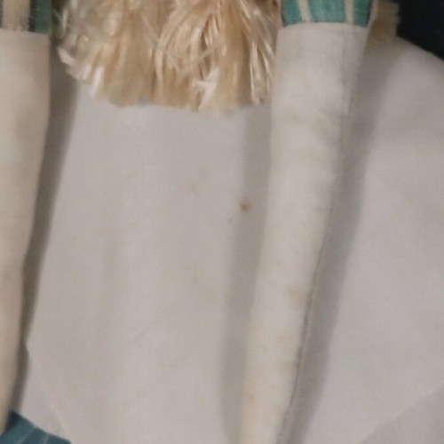 Handmade doll used with fabrics and detailed design
