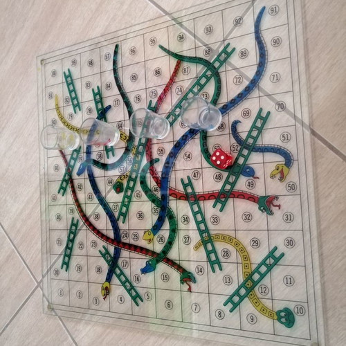 Glass Snakes & Ladders board game used with shot glasses