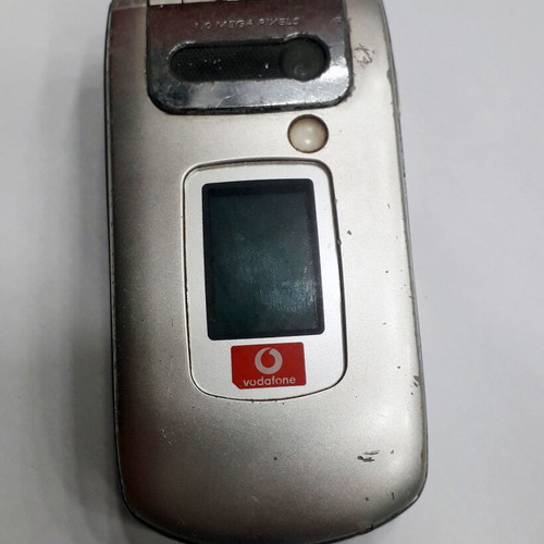 Sharp GX30 mobile phone used, silver, missing antenna part