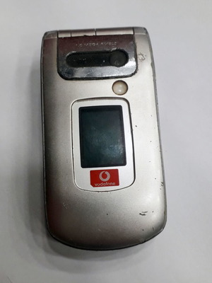 Sharp GX30 mobile phone used, silver, missing antenna part