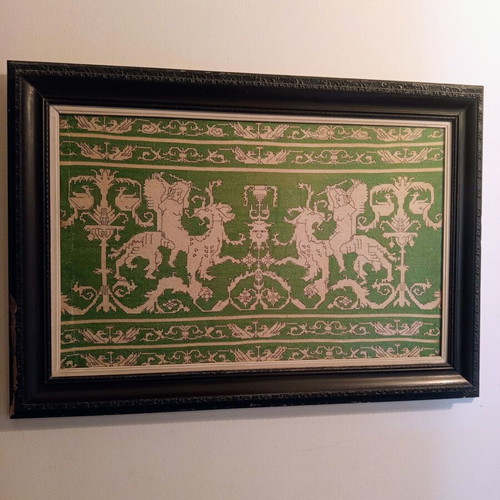 Handmade embroidery in large black Corinthian-style frame, used