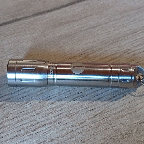 Mini stainless steel LED flashlight like new, AAA battery
