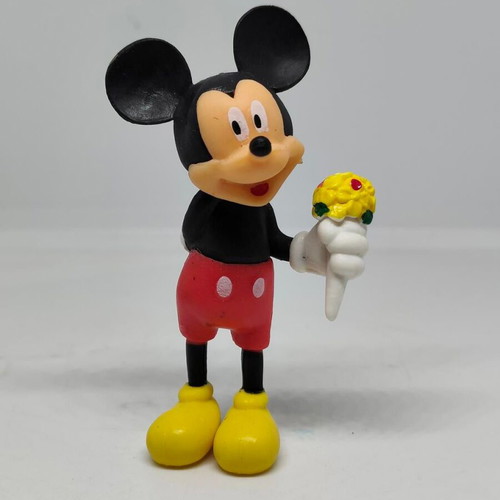 Collectible Mickey Mouse figure like new with bouquet