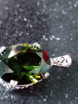 Pendant with green lab topaz in silver-plated base like new
